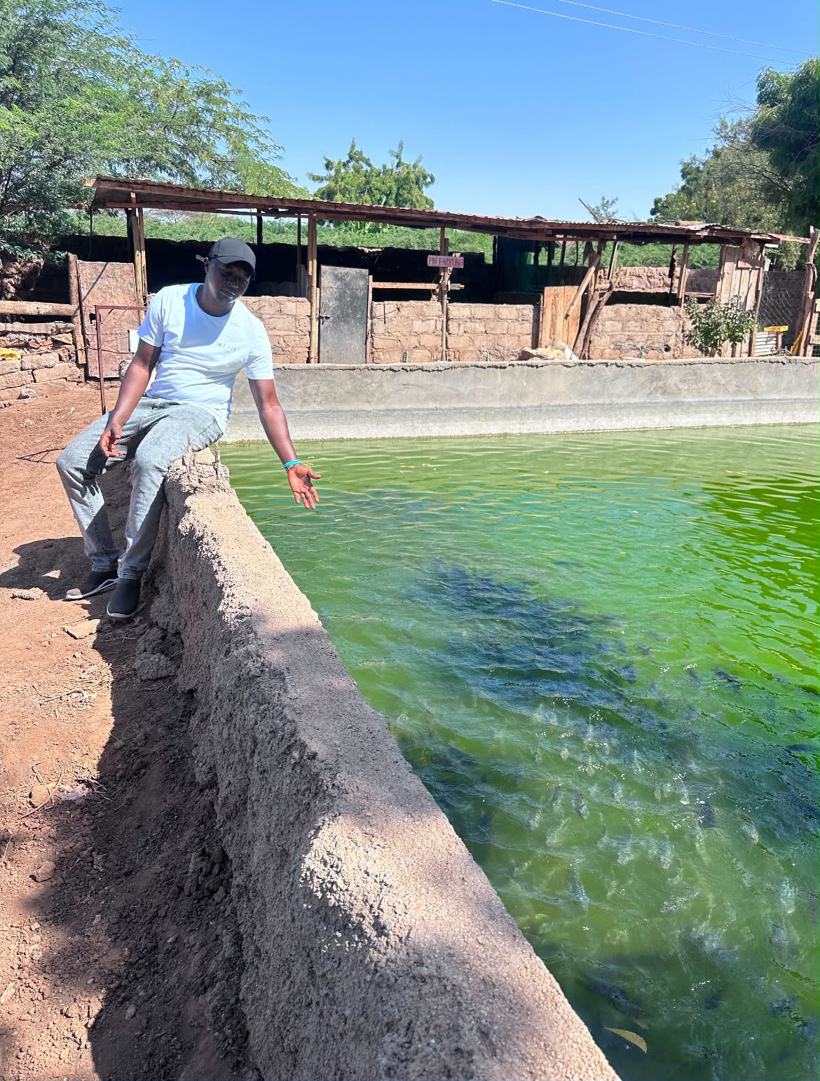 FWA team visiting a fish pond on a Kenyan farm